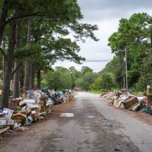 an insurance adjuster surveys damage from harvey